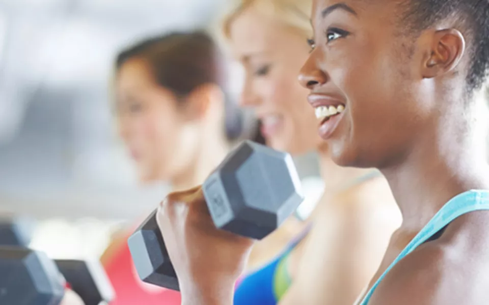 Young lady working out in a group setting a the YMCA