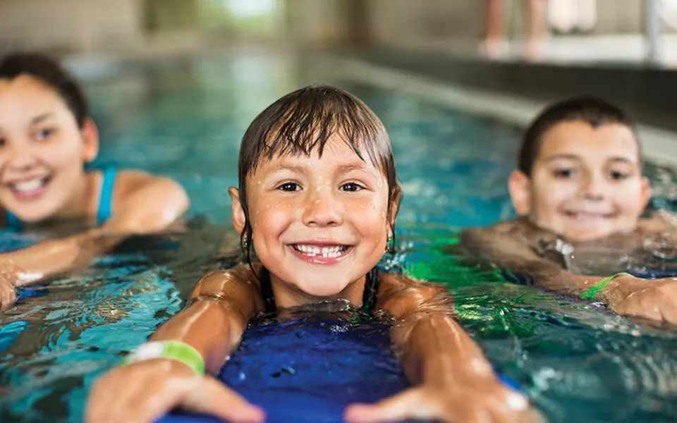 Children in indoor pool siwmming