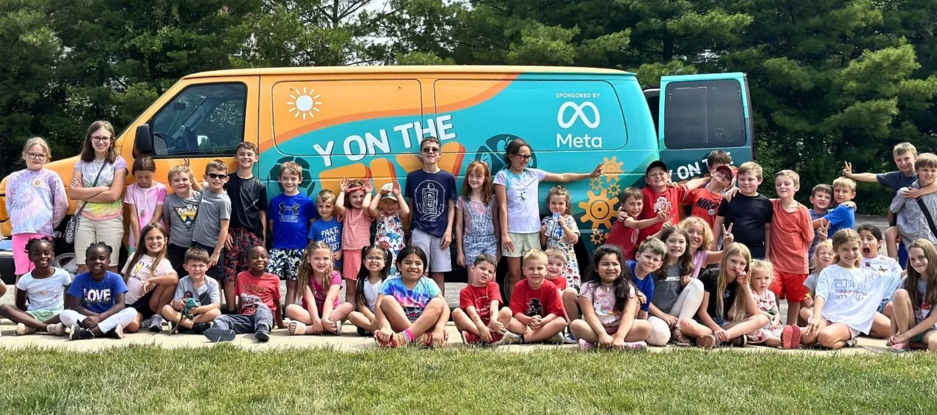 Kids in front of the Y on the Fly Van for West Licking